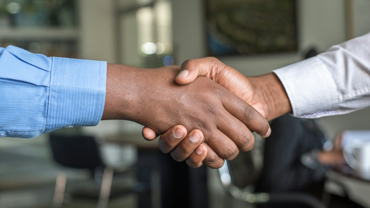 Two business partners shaking hands