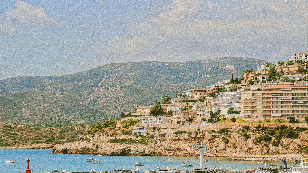 Buildings in a coastal town beside the sea